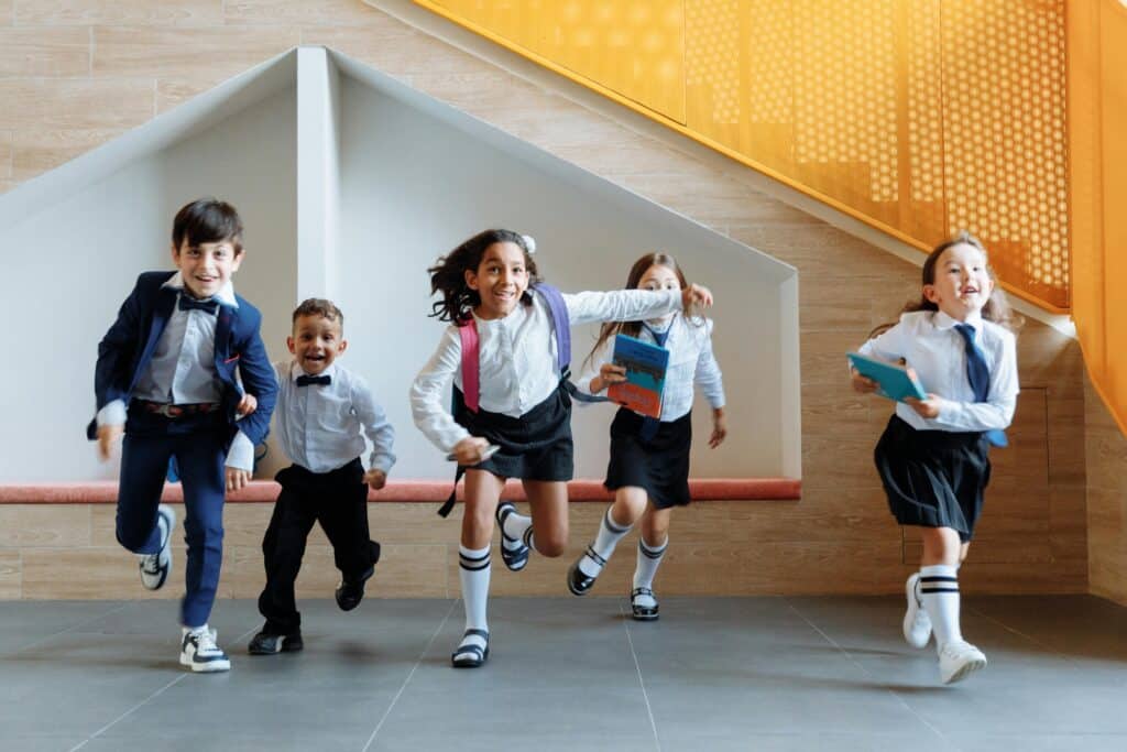 Students running together on the first day, symbolizing a fresh start with back to school resources for teachers